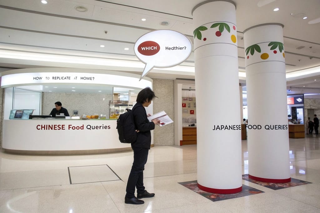 A visually engaging Q&A stand bridging common questions about Chinese and Japanese cuisines, highlighting their key differences.