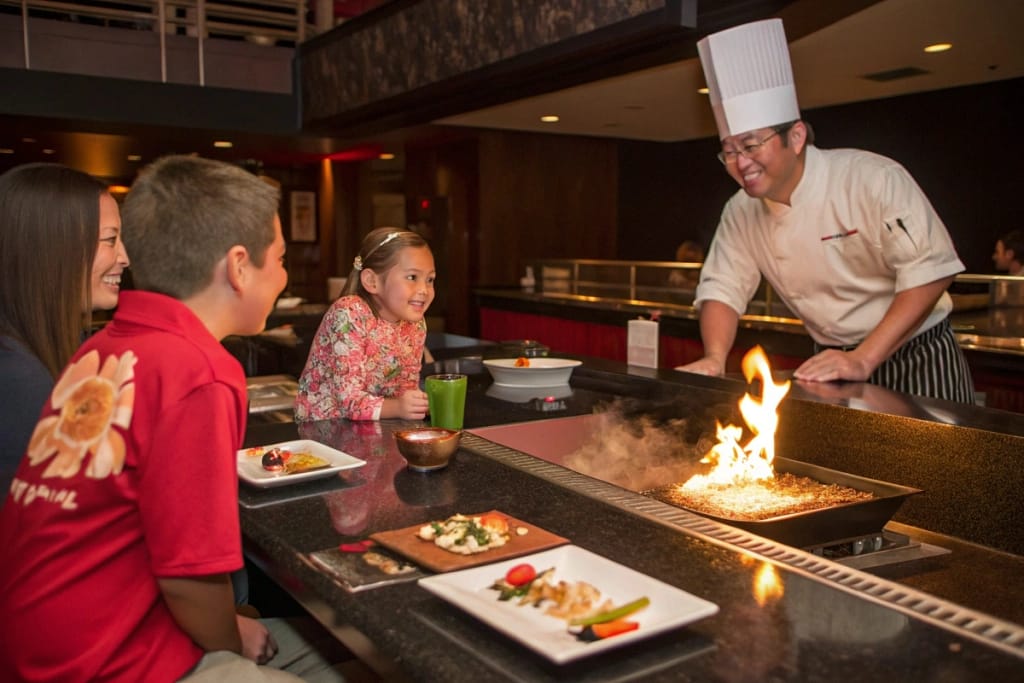 A triptych illustration of typical Japanese dining scenarios in Flowood: family sushi outing, hibachi date night, and a business lunch at a fusion restaurant.