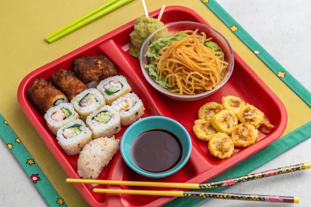 Assortment of kid-friendly Japanese fast food items presented in a colorful and appealing tray.