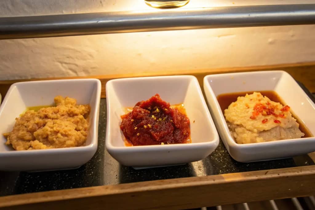  A comparison of three distinct miso pastes—shiro, red, and kara—highlighting how chili-infused kara miso stands out.